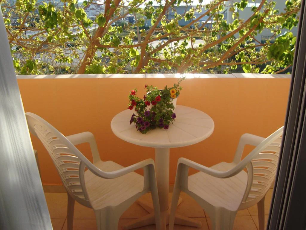 Flowers beside the balcony seating