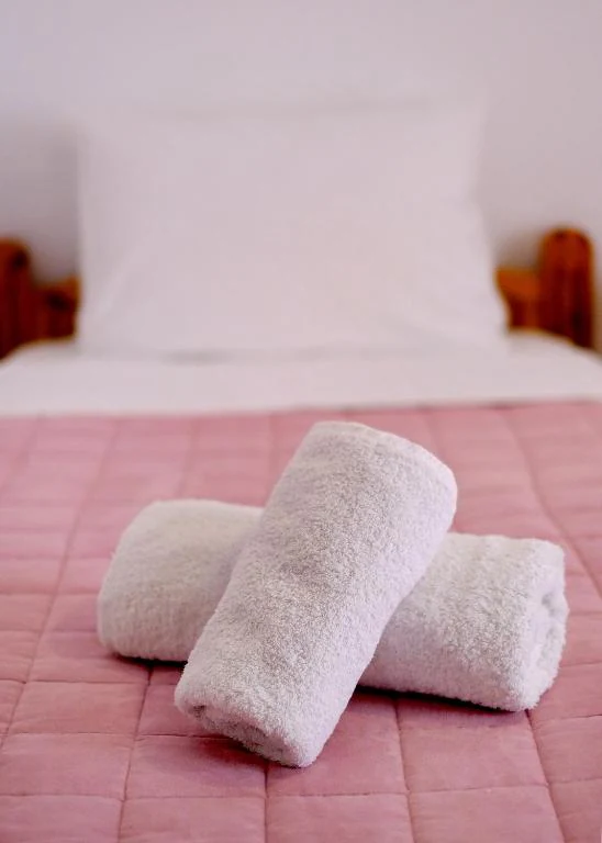 Fresh towels on the bed