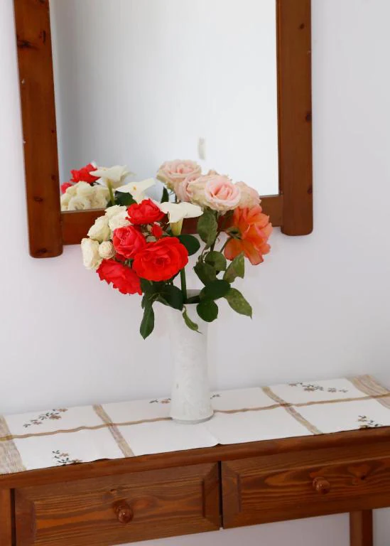 Flowers and a wooden dressing table